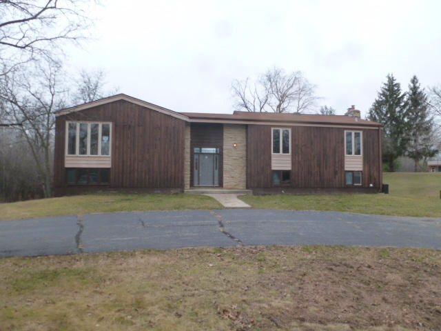 Property Photo:  W313s7611 Spring Ln  WI 53149 