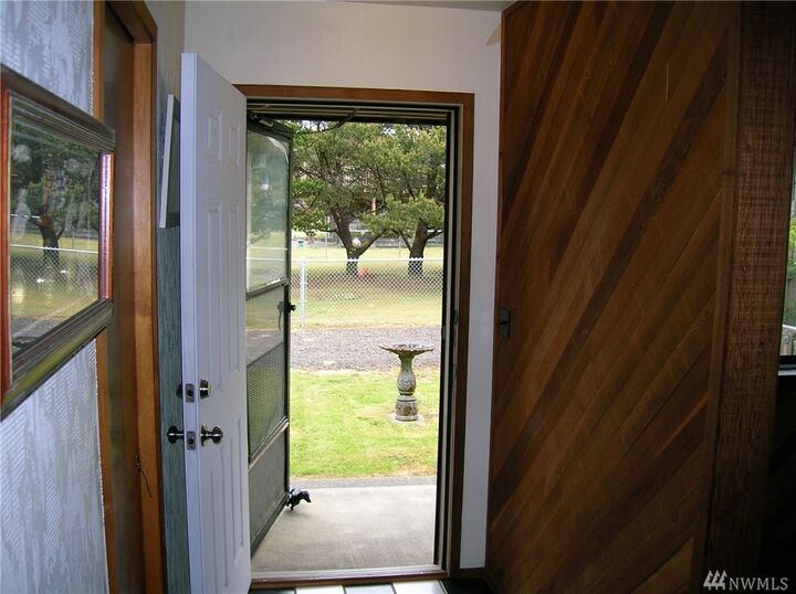 Property Photo:  205 W Wind Sand Lane  WA 98547 