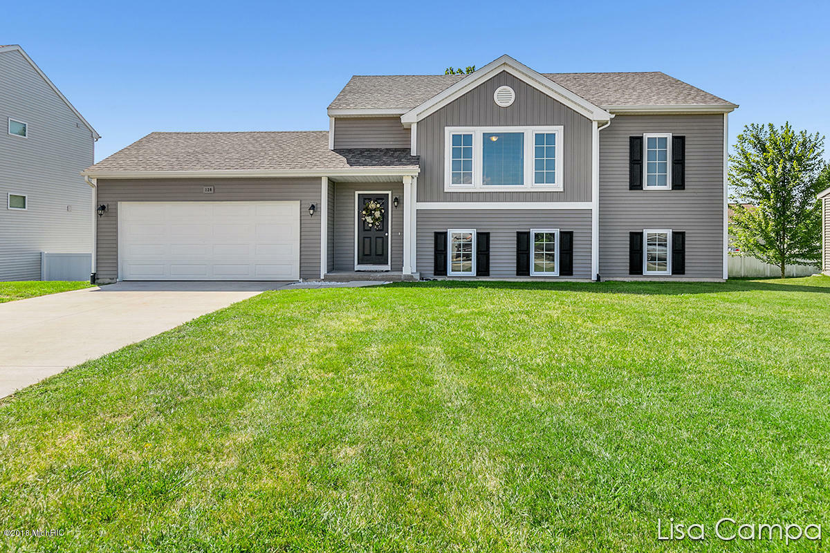 Property Photo:  128 Bluegrass Drive  MI 49424 