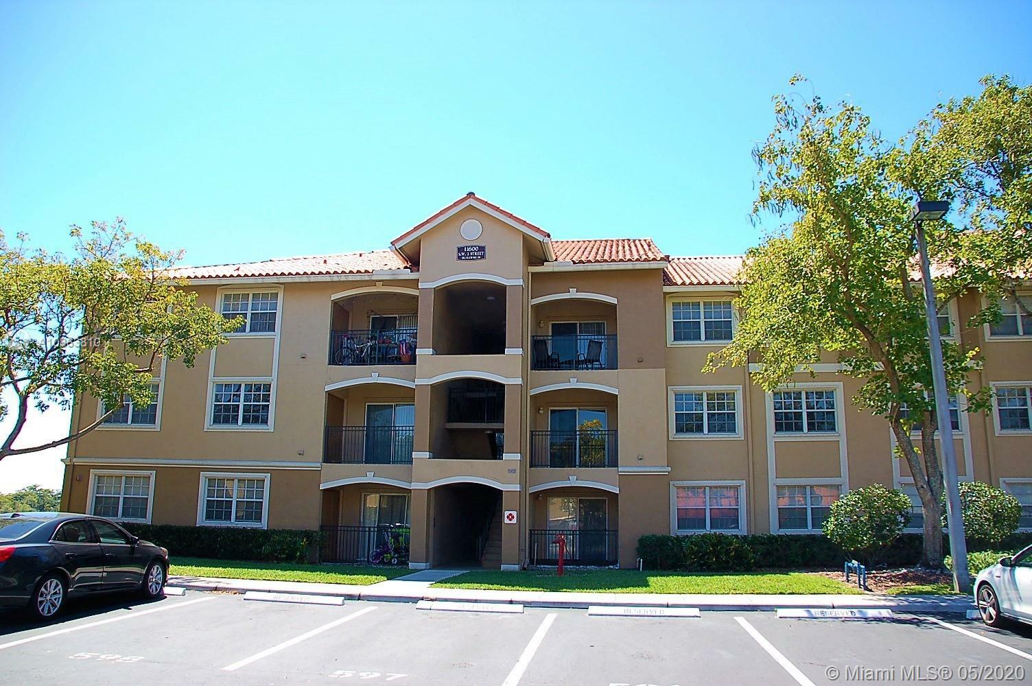 Property Photo:  11600 SW 2nd St 18-203  FL 33025 