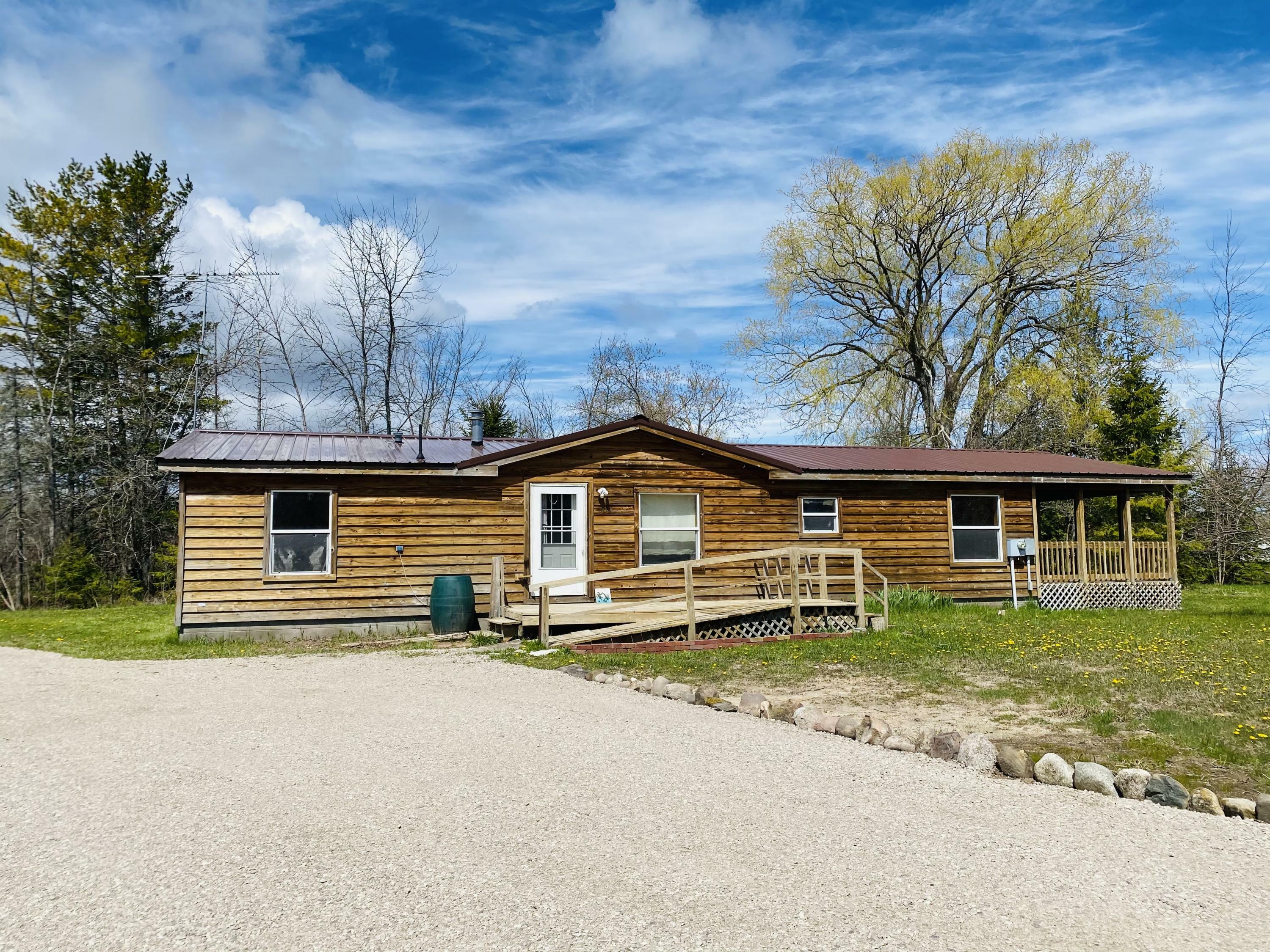 Property Photo:  400 Palmyra Street  MI 49721 