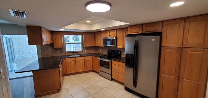 Property Photo:  8635 Elm Leaf Court  FL 34668 