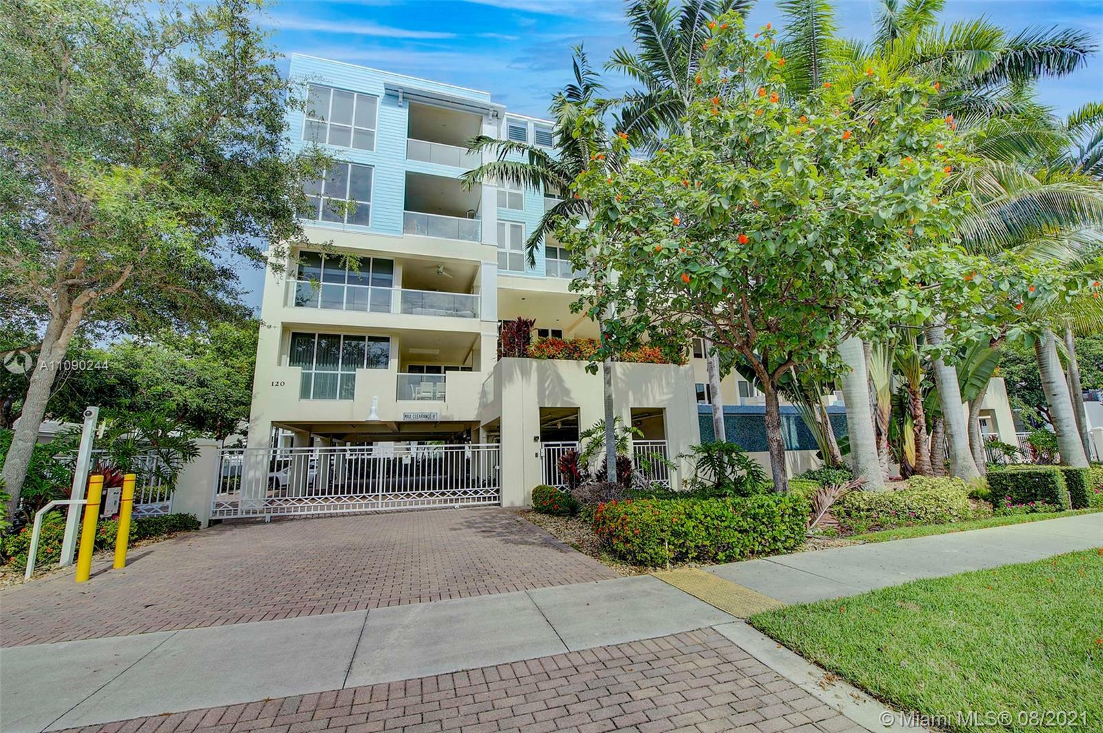 Property Photo:  120 SE 19th Ave 404  FL 33441 