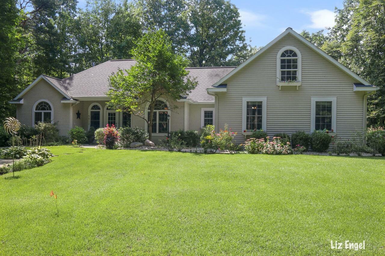 Property Photo:  5812 Hunters Ridge  MI 49408 