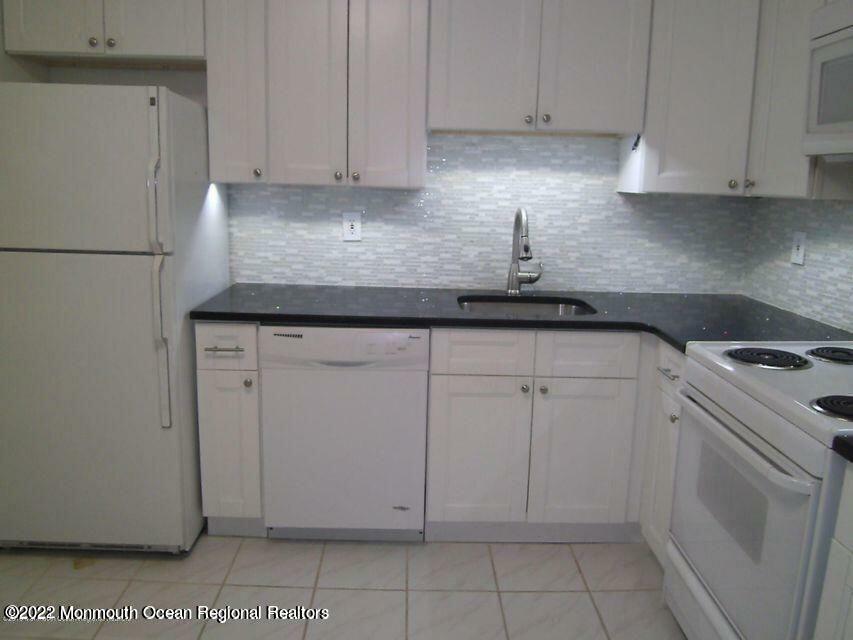 Property Photo:  115 Amberly Drive H  NJ 07726 