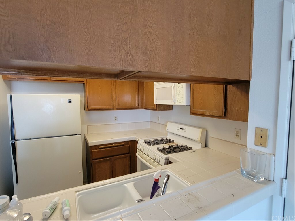 Property Photo:  18272 Parkview Lane 203  CA 92648 