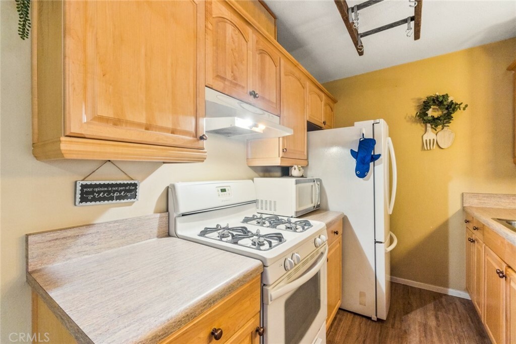 Property Photo:  15325 Santa Gertrudes Avenue J203  CA 90638 