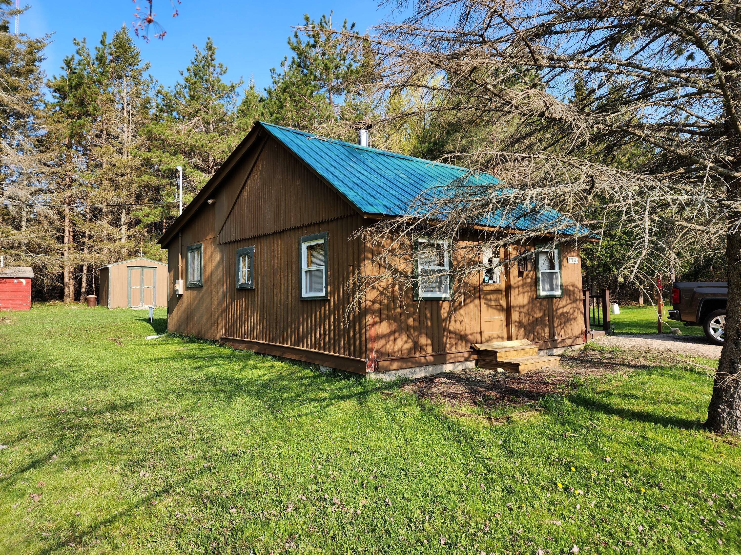 Property Photo:  17858 M-48  MI 49736 