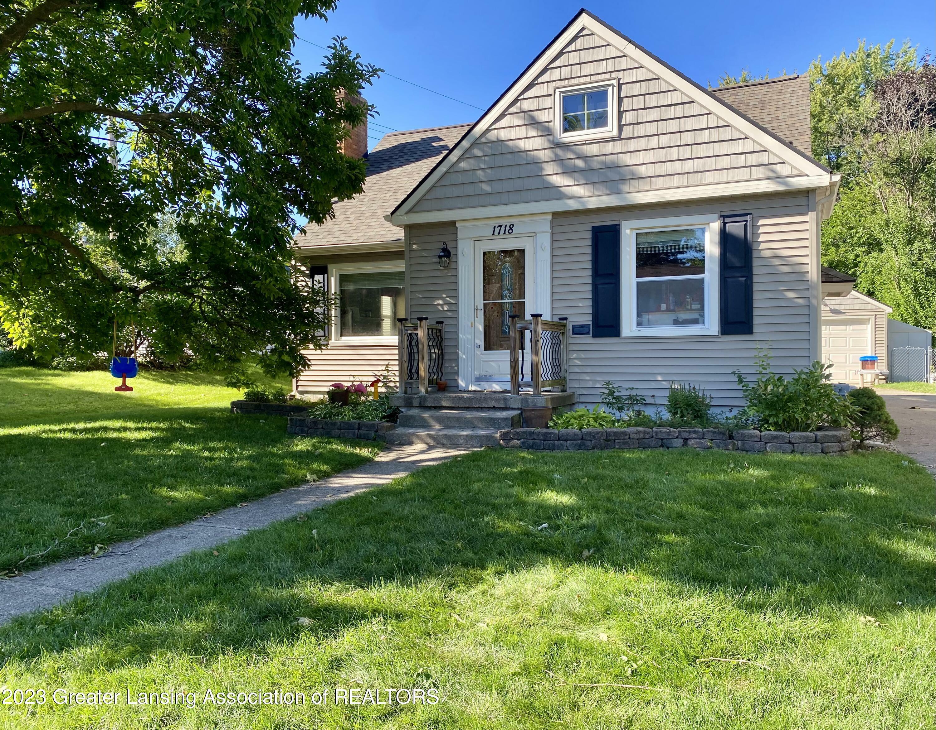 Property Photo:  1718 Cooper Avenue  MI 48910 