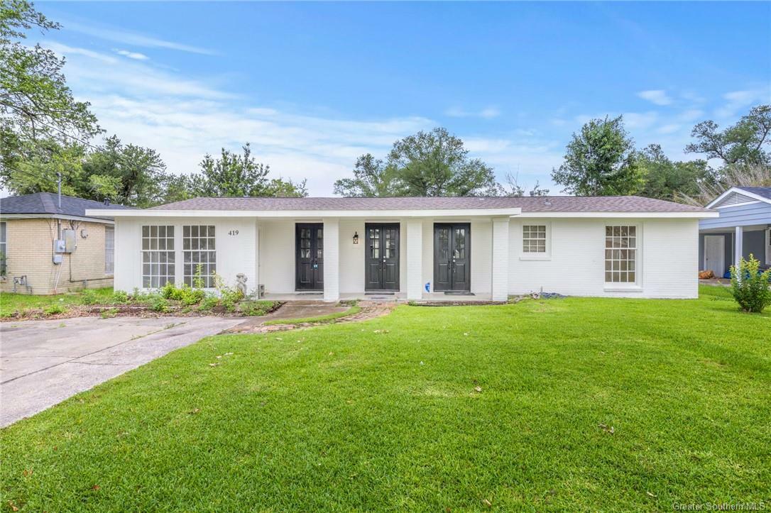 Property Photo:  419 E Claude Street  LA 70605 