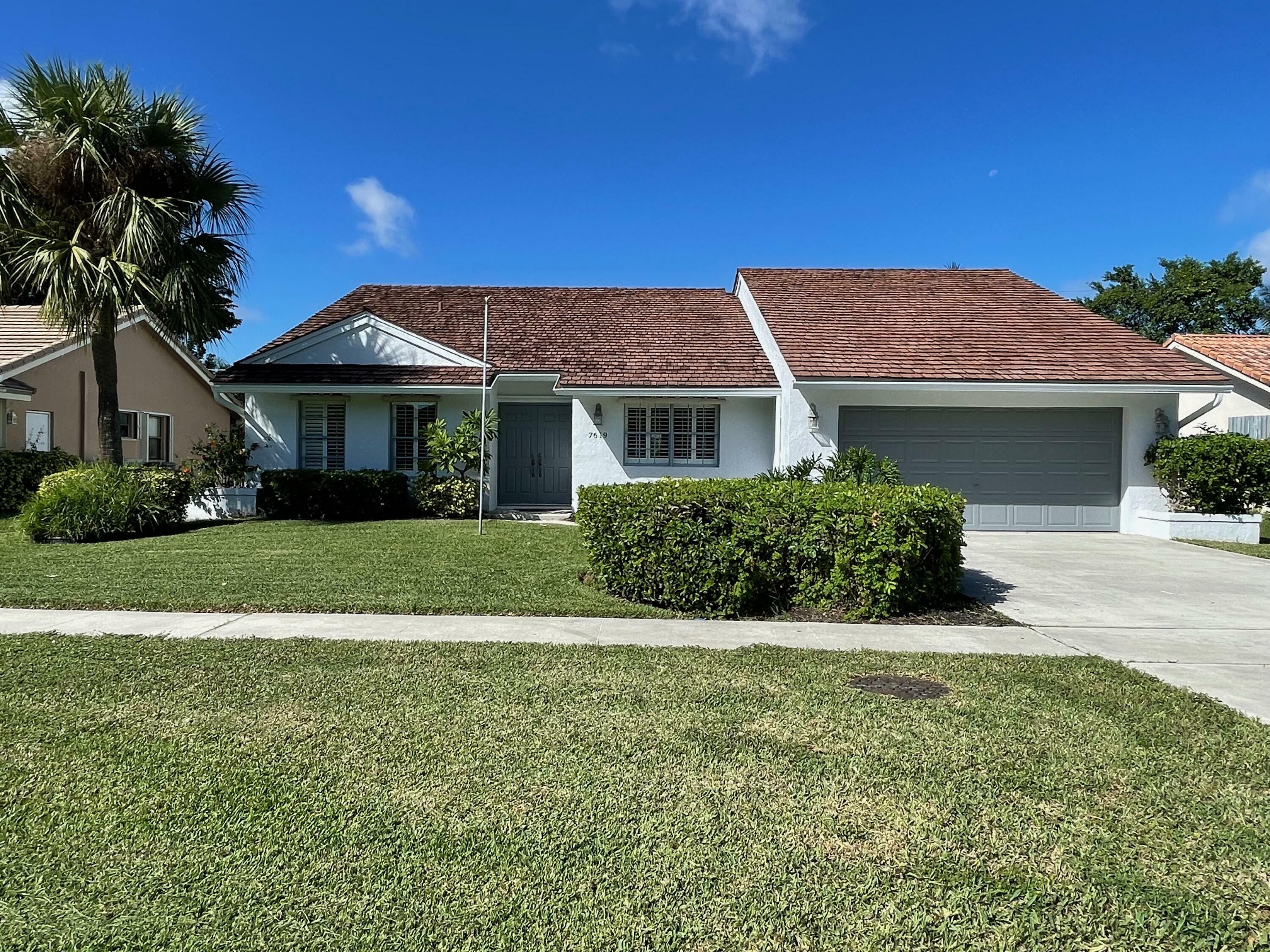 Property Photo:  7619 W Country Club Boulevard  FL 33487 