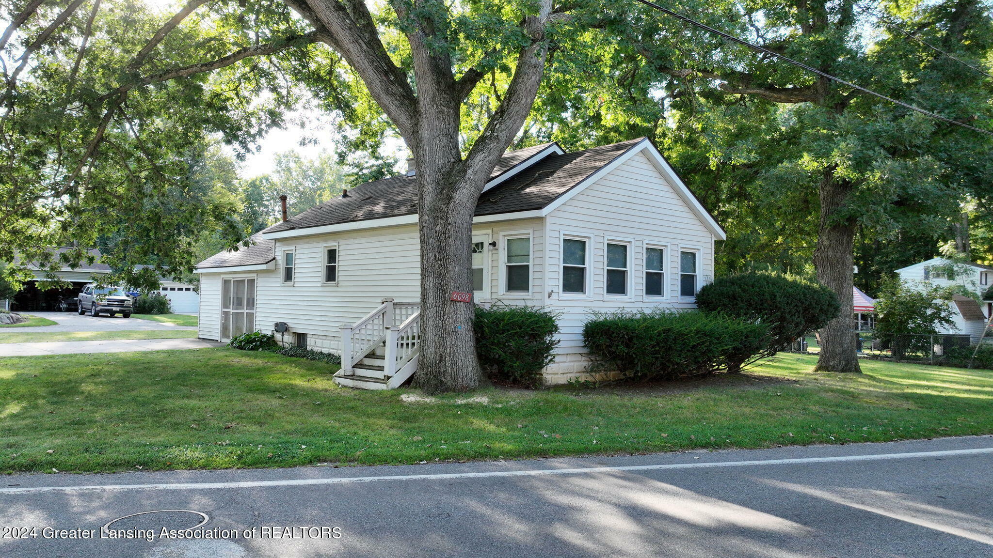 Property Photo:  6098 E Lake Drive  MI 48840 