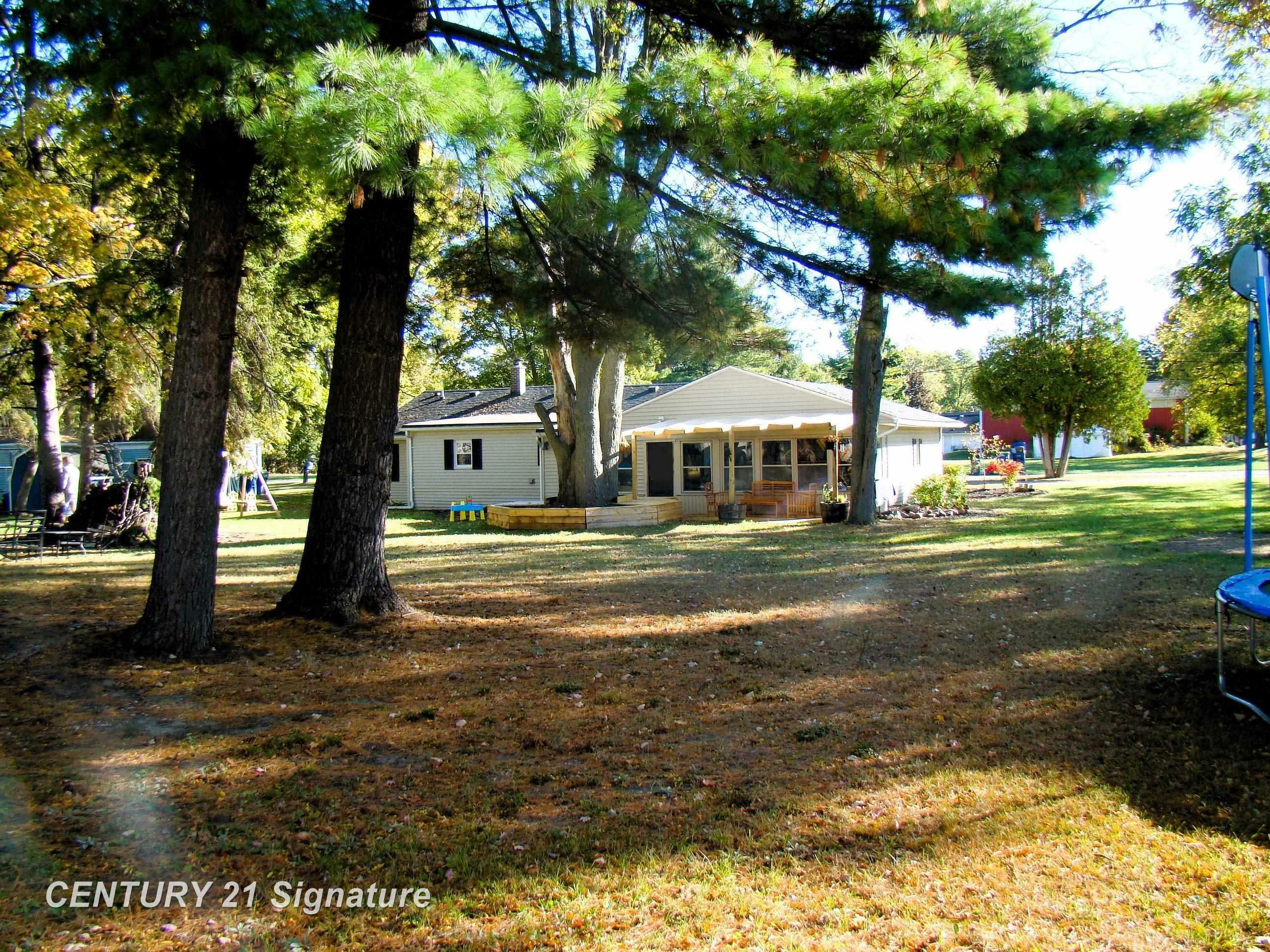 Property Photo:  201 Harrison Drive  MI 48609 