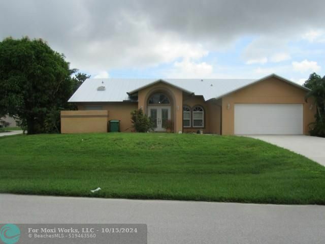 Property Photo:  6958 NW Hartney Way  FL 34983 