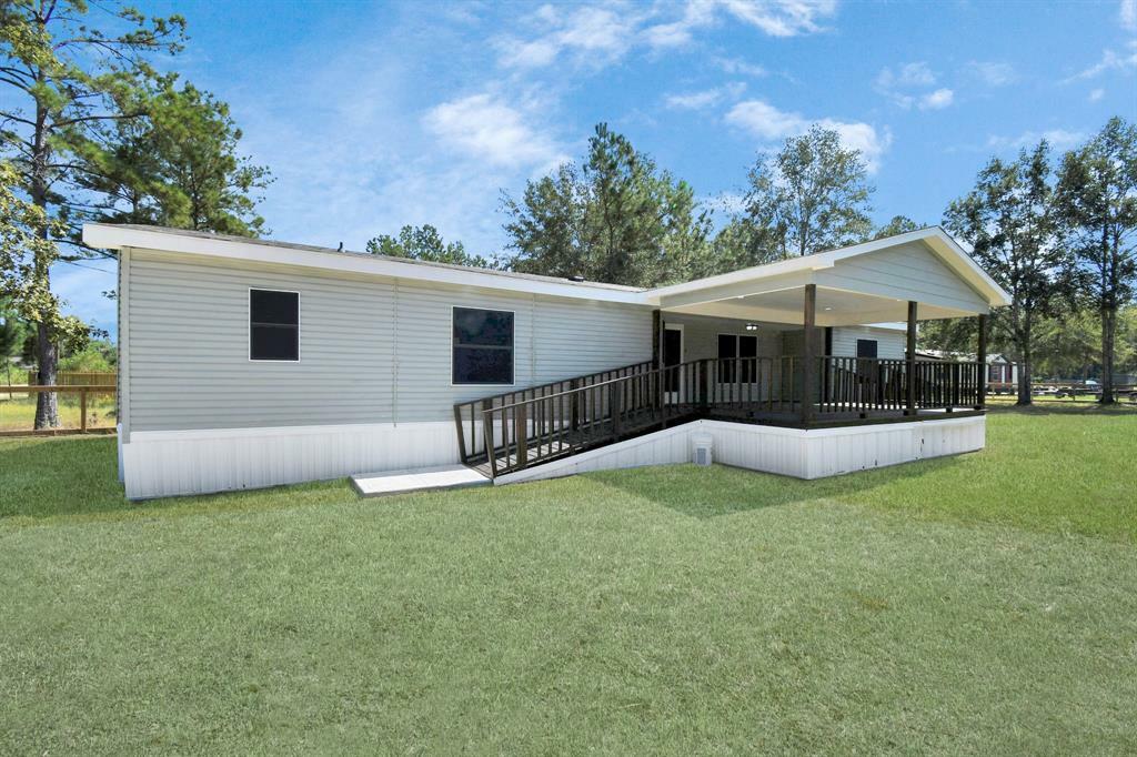 Property Photo:  422 County Road 3414  TX 77327 