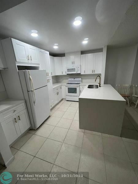 Property Photo:  10777 W Sample Rd 103  FL 33065 