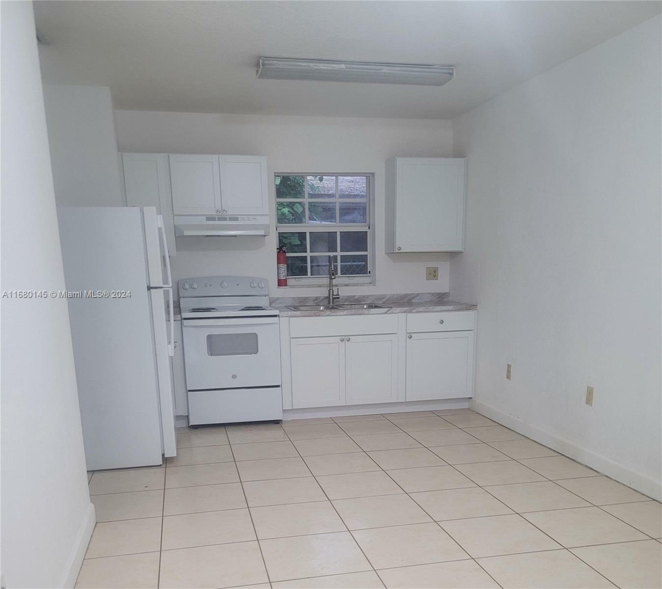 Property Photo:  408 NW 11th Ave  FL 33128 