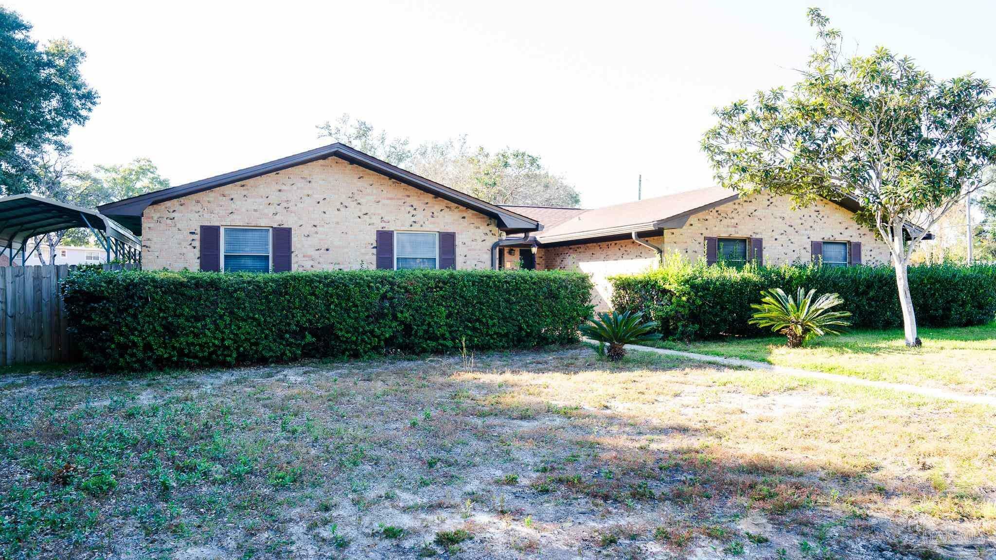 Property Photo:  311 N 57th Ave  FL 32506 