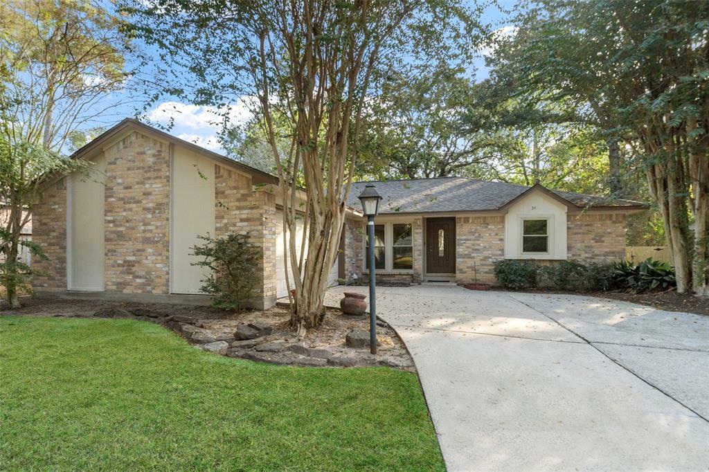 Property Photo:  34 N Drifting Leaf Court  TX 77380 