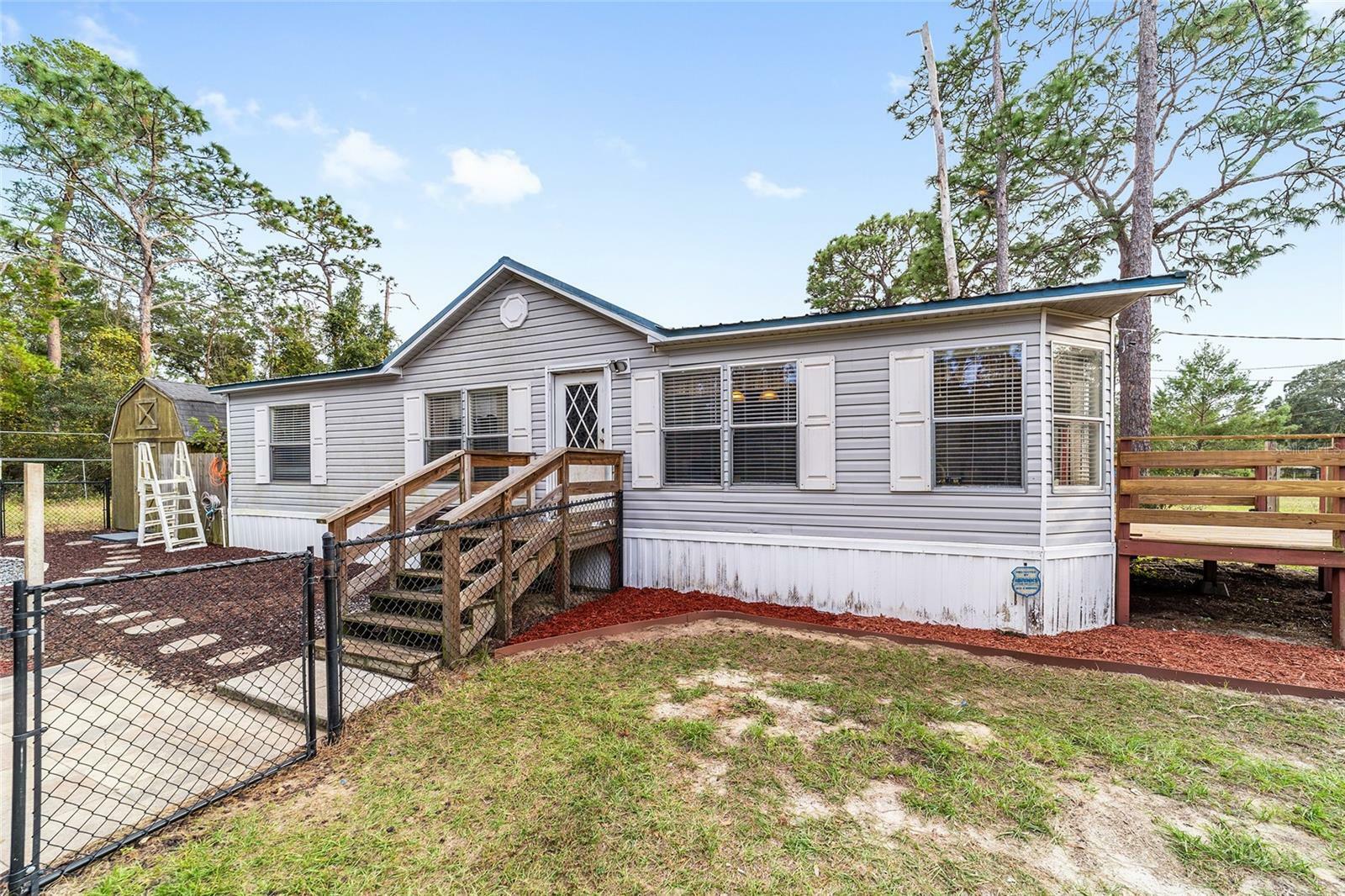 Property Photo:  19702 SE 91st Street  FL 32179 