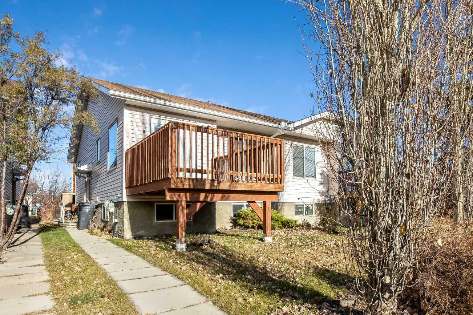 Property Photo:  128 8 Avenue SE  AB T1V 1R8 