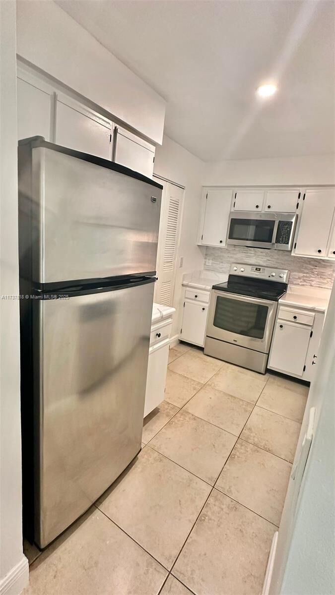Property Photo:  1245 SW 46th Ave 1209  FL 33069 