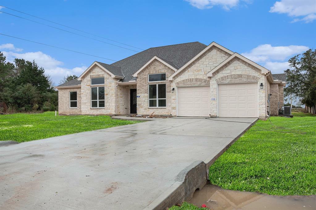 Property Photo: 208 Wells TX 77445