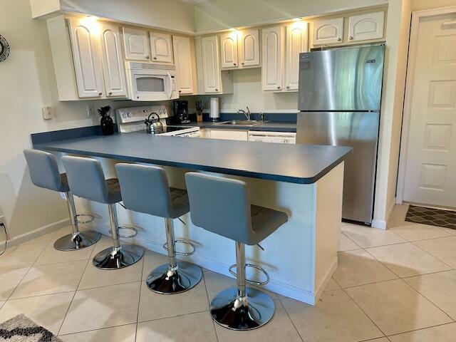 Property Photo: 501 Greensward Lane 203-C FL 33445