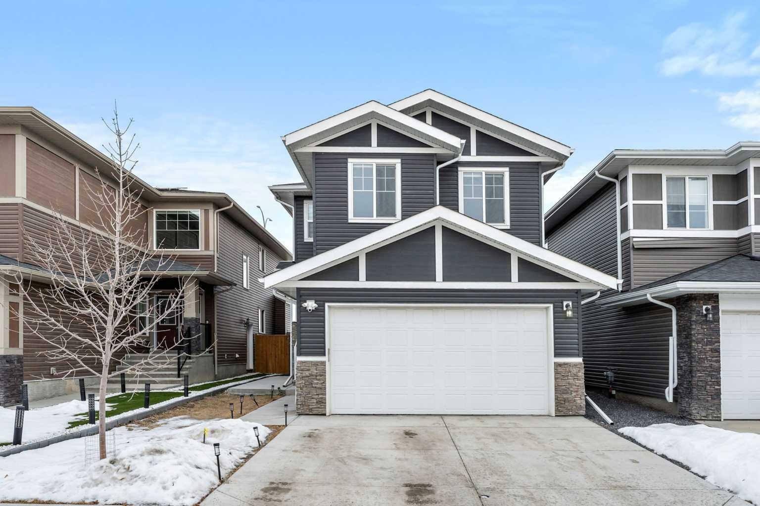 Property Photo: 126 Creekside Way SW AB T2X 4B1