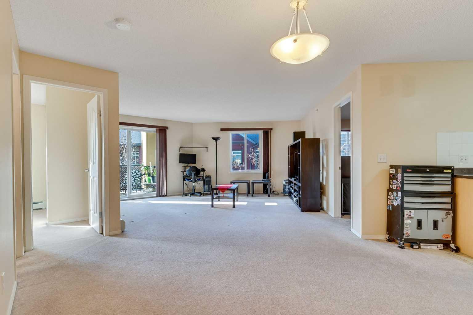 Property Photo: 304 Mackenzie Way SW 8421 AB T4B 3H8
