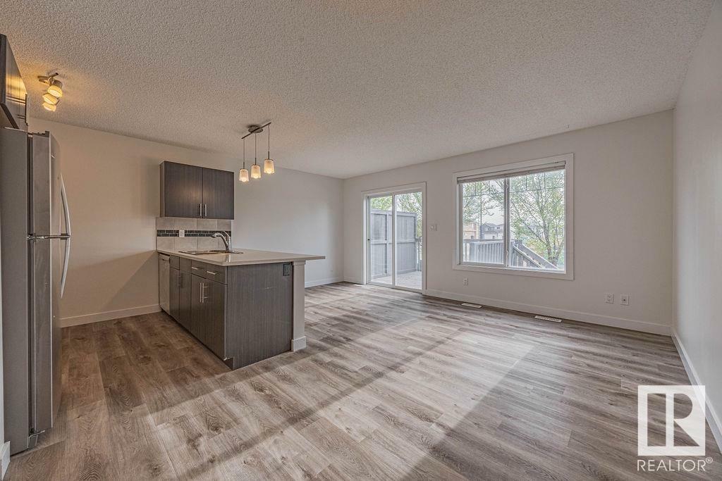 Property Photo: 2004 Trumpeter Way NW 30 AB T5S 0J9