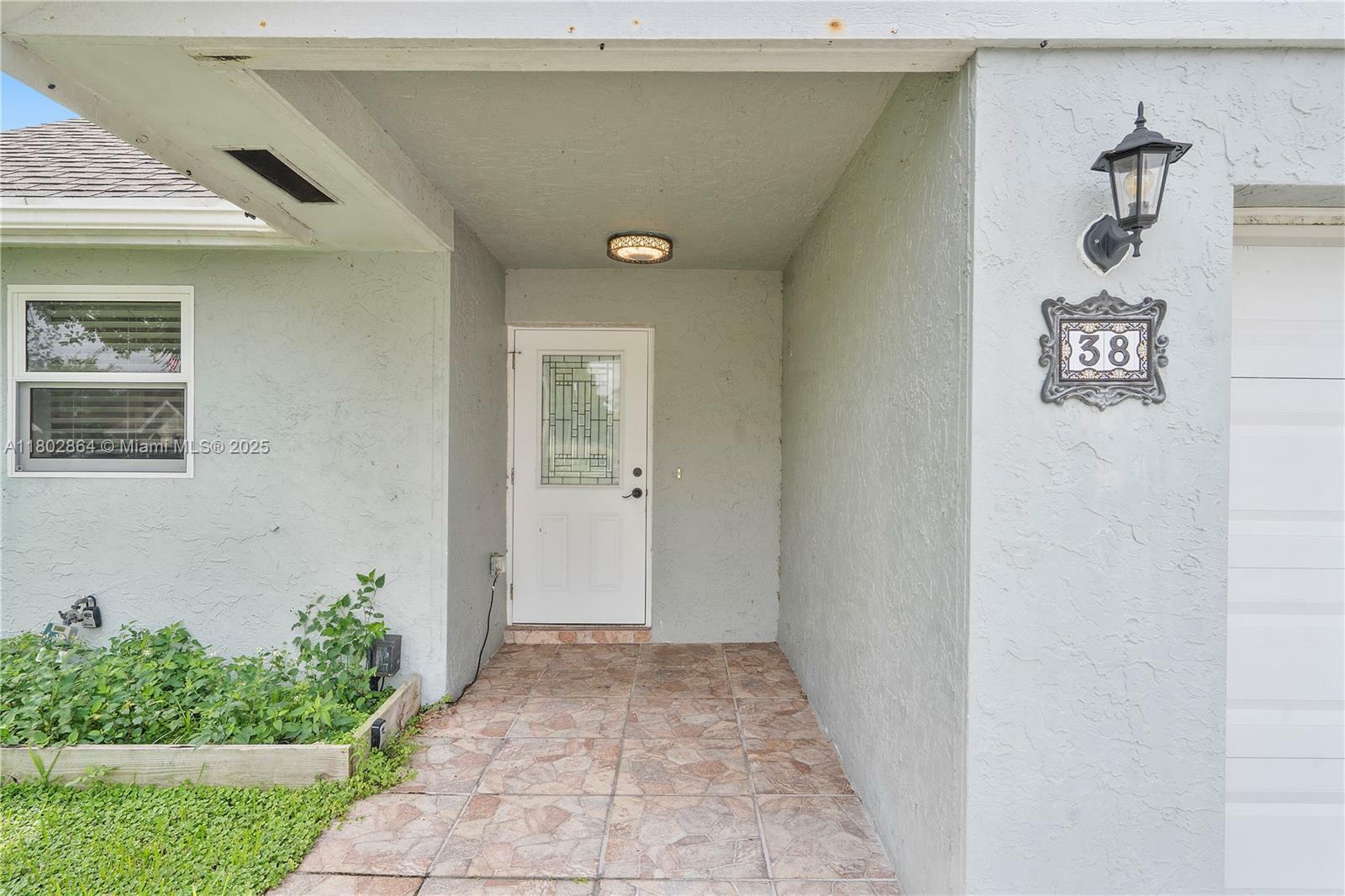 Property Photo: 38 E Tara Lakes Dr E 1 FL 33436