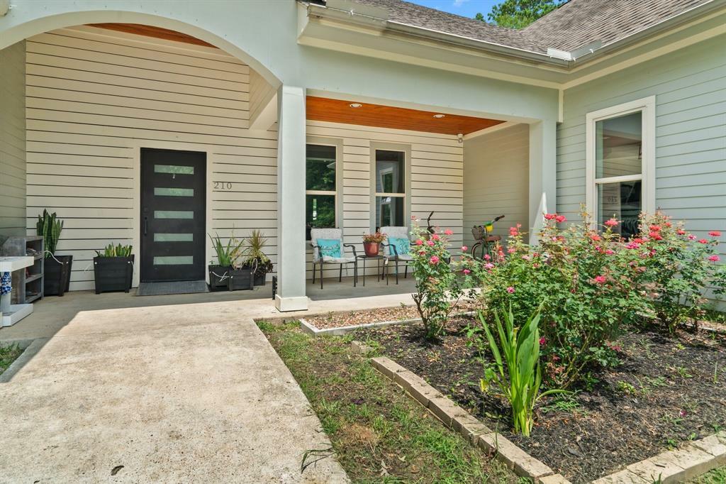 Property Photo: 210 County Road 3311 TX 77327