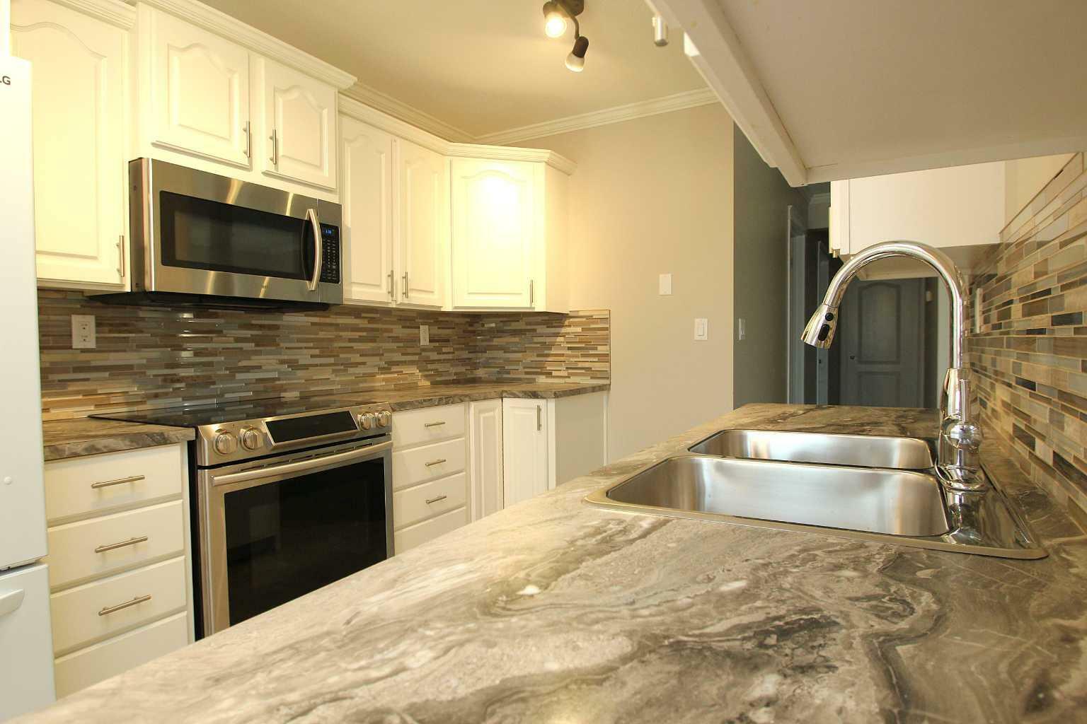 Property Photo: 52 McLevin Crescent AB T4R 1S9
