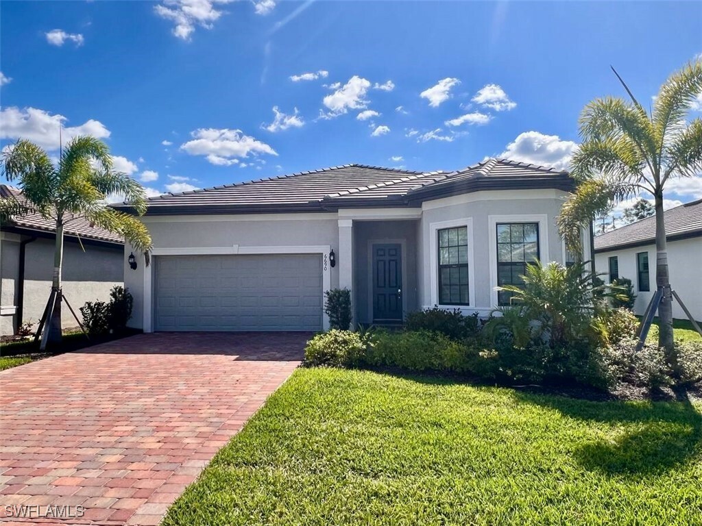 Property Photo: 6690 Pennyroyal Drive FL 34114