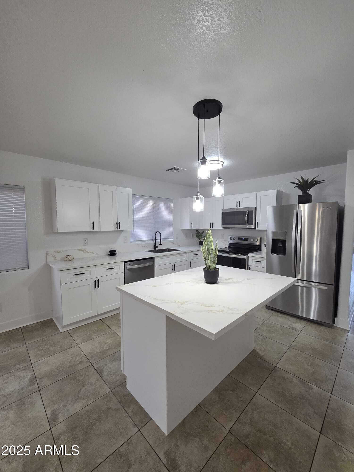 Property Photo: 13606 N 130th Avenue AZ 85335