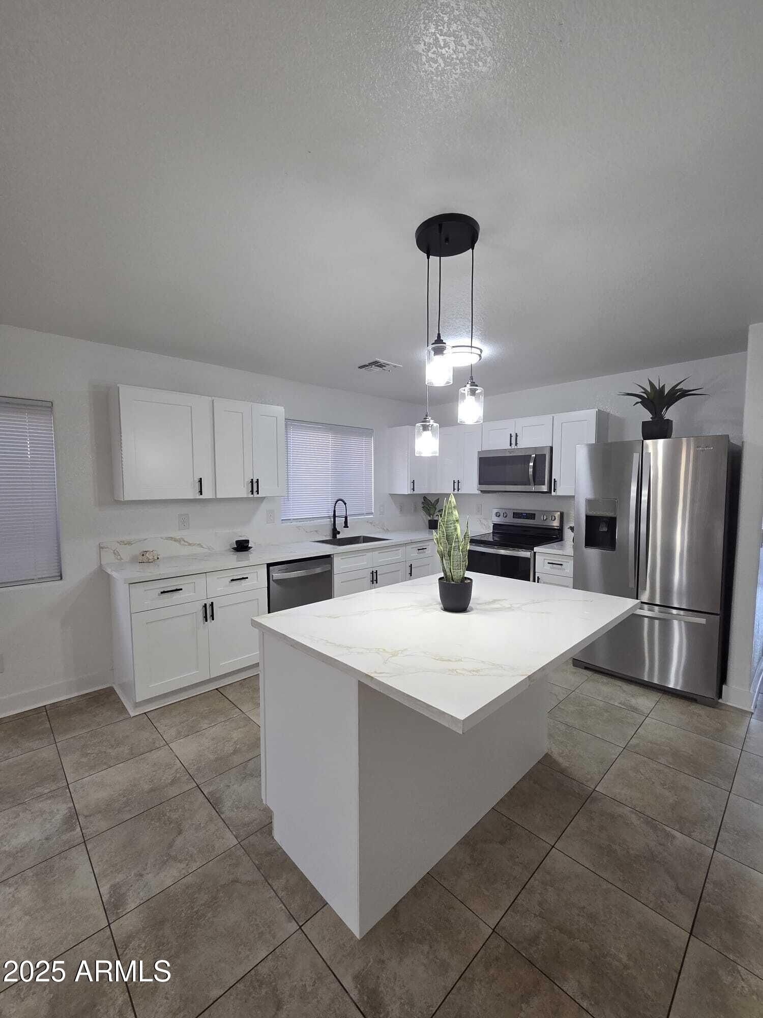 Property Photo: 13606 N 130th Avenue AZ 85335
