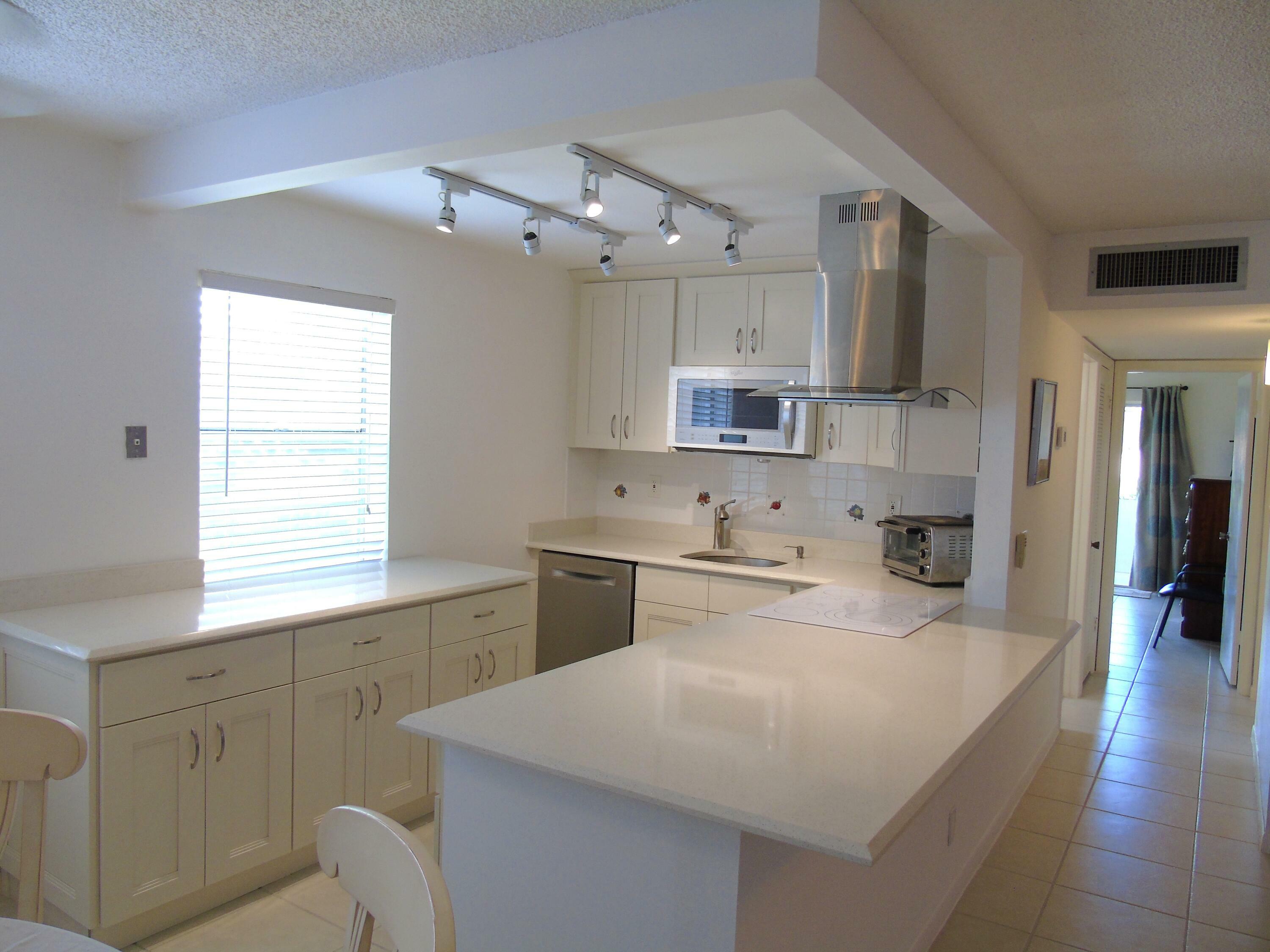 Property Photo:  219 Normandy E  FL 33484 