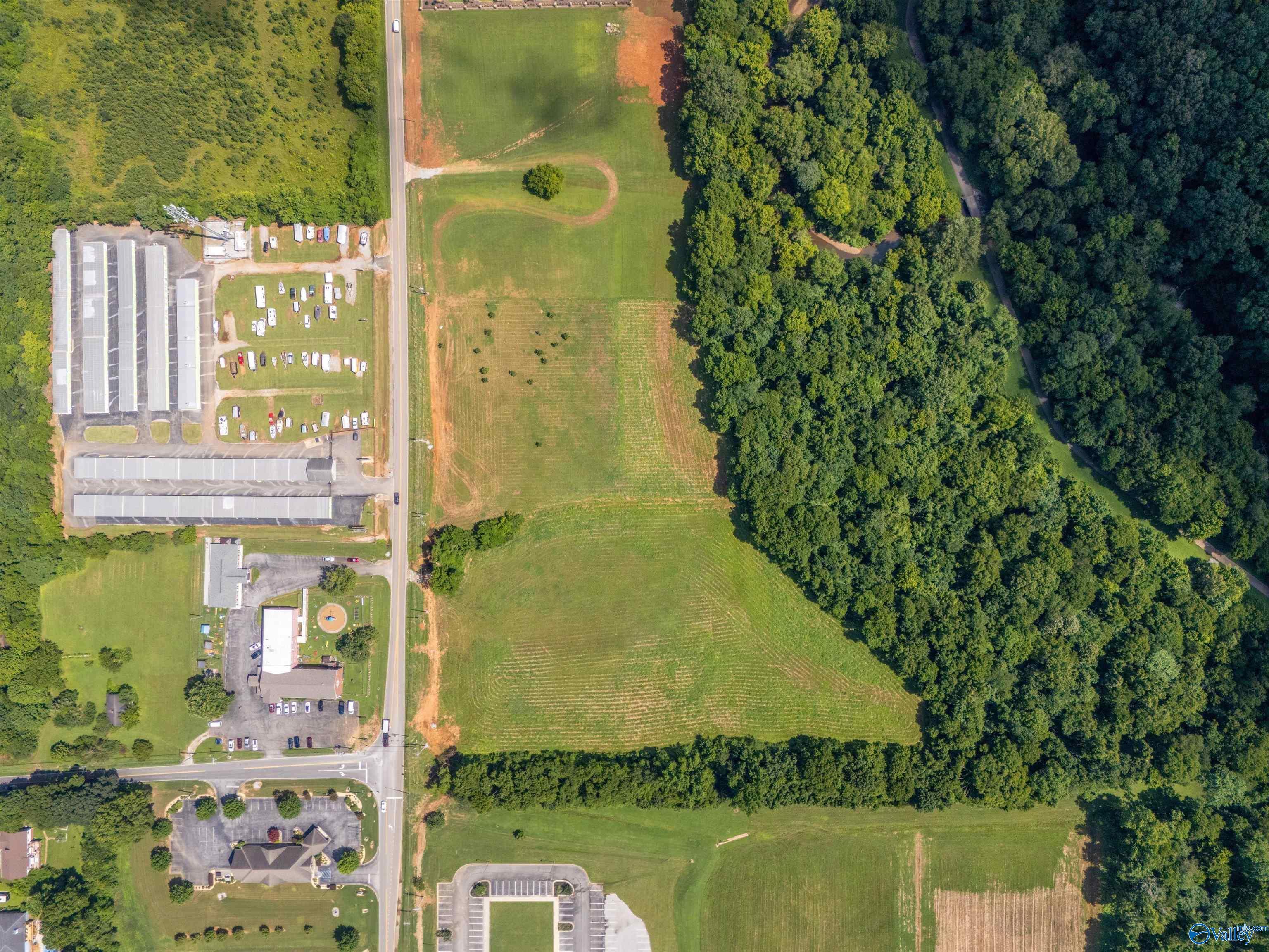 Property Photo:  5.6 Acres A Slaughter Road  AL 35758 