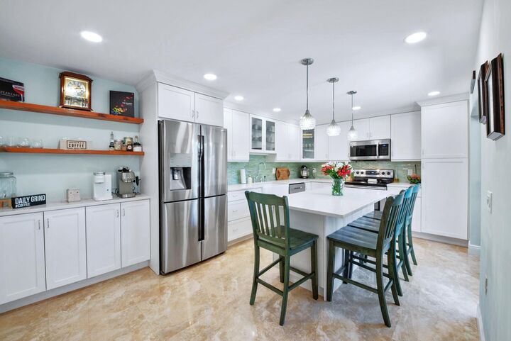 Property Photo:  311 Buttonwood Lane  FL 33436 
