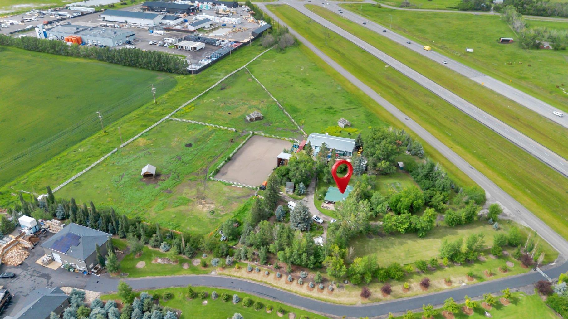 Property Photo: 338067 1067 Drive E 10 AB T1S 4T2