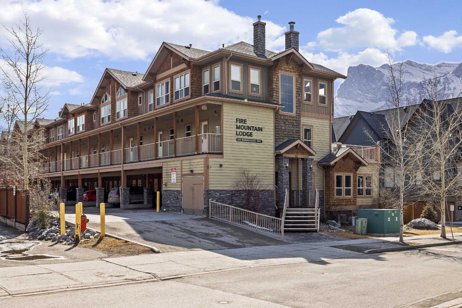 Property Photo: 121 Kananaskis Way 207 AB T1W 0B2