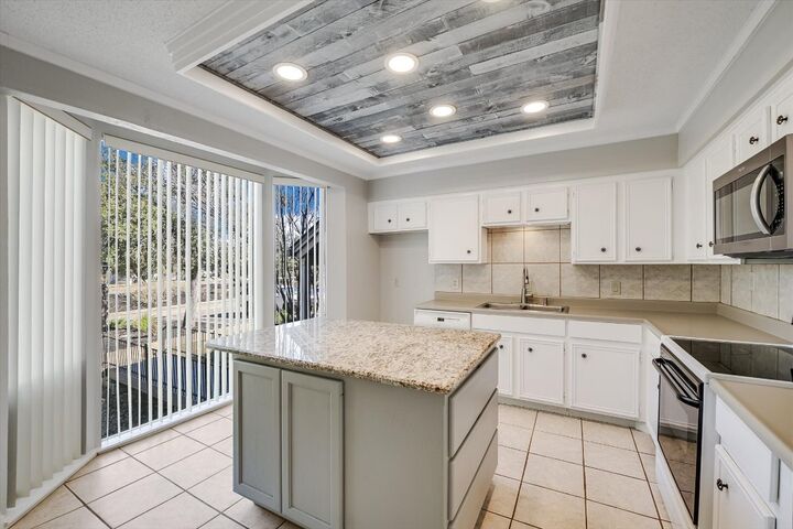 Property Photo:  115 World Of Tennis Square  TX 78738 