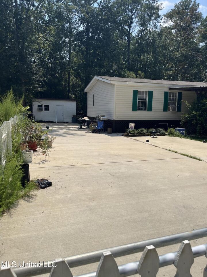 Property Photo:  7853 Petunia Road  MS 39553 