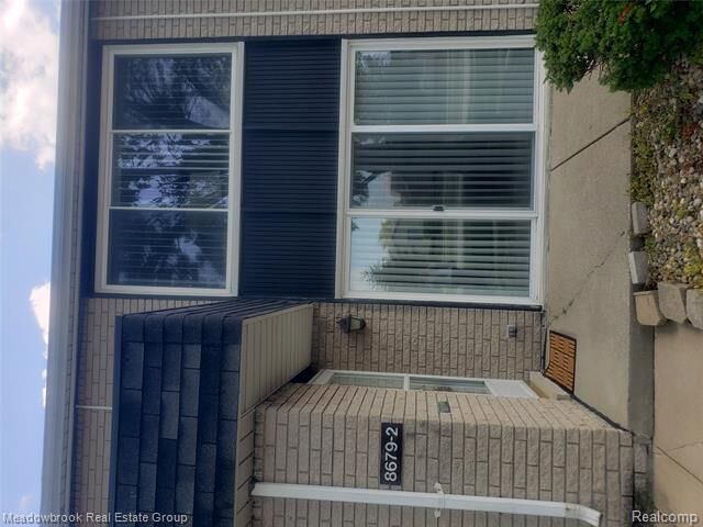 Property Photo: 8679 Kennedy Circle N 2 MI 48093
