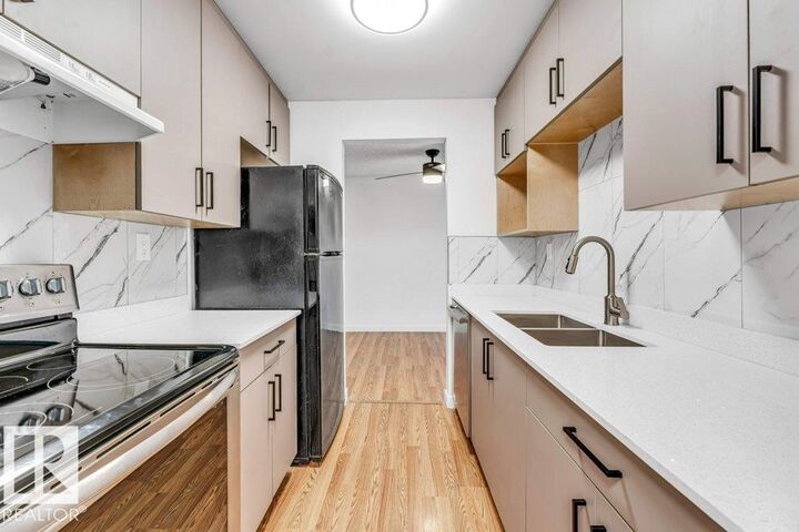 Property Photo: 1620 48 Street NW 311 AB T6L 5B1