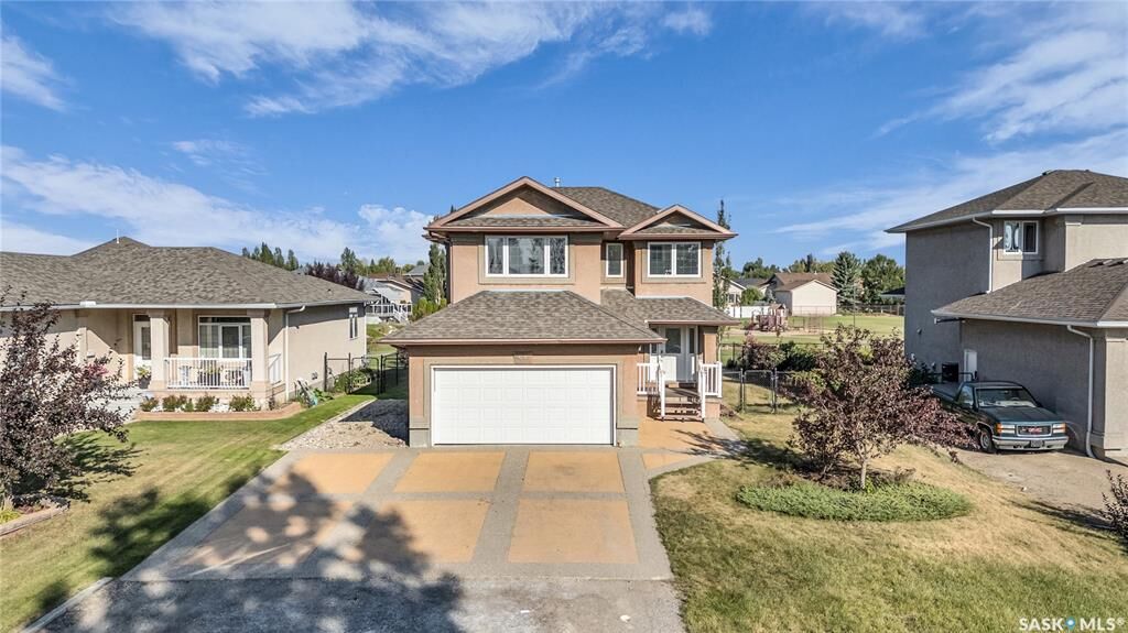 Property Photo: 64 Woods Crescent SK S4L 1C5