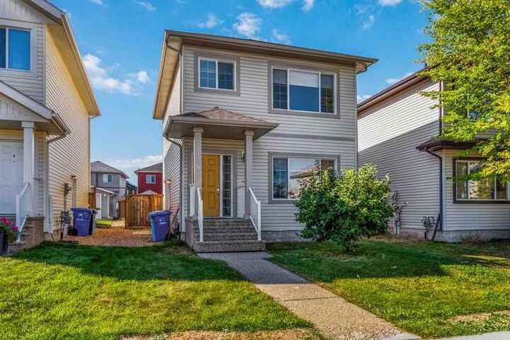 Property Photo:  128 Juniper Street  AB T9K 0M8 