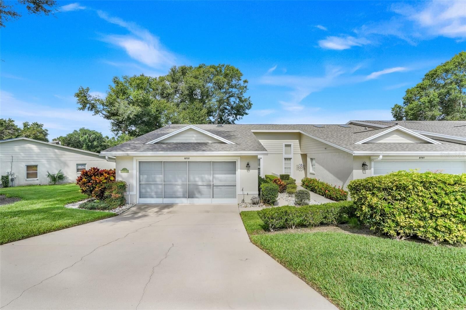 Property Photo:  8737 Village Green Boulevard  FL 34711 