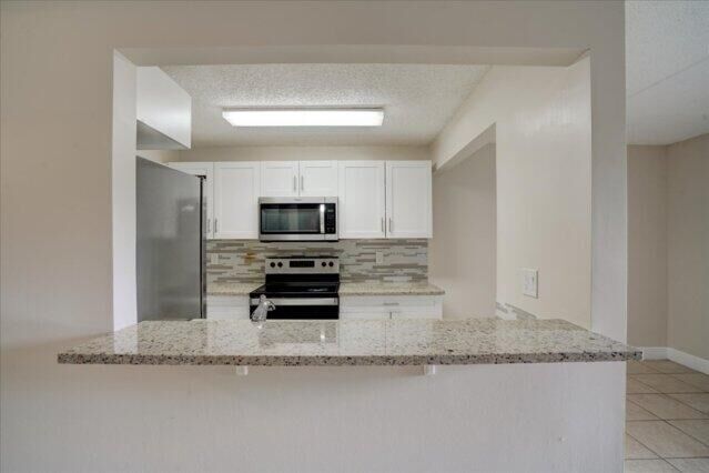 Property Photo: 1104 Meadows Circle 1104 FL 33436